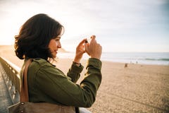 Tourist woman taking pictures with her smart phone royalty free stock image Tourist woman taking pictures with her smart phone royalty free stock image