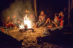 Tourists around the campfire at night. Royalty Free Stock Photography Tourists around the campfire at night. Royalty Free Stock Photography