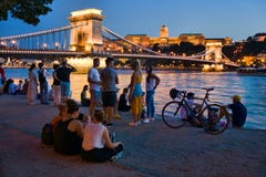 Tourists by the Danube river in Budapest
