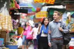 Tourists shopping in street market in Hong Kong royalty free stock photos Tourists shopping in street market in Hong Kong royalty free stock photos