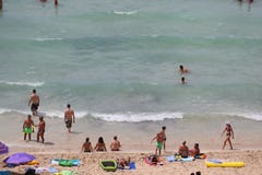 Tourist sunbathe or bath on the sea in El Arenal beach in Mallorca Royalty Free Stock Image Tourist sunbathe or bath on the sea in El Arenal beach in Mallorca Royalty Free Stock Image