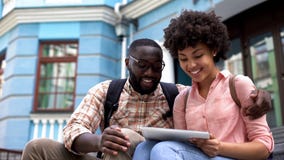 Tourists using travel guide application tablet, educational program for students stock image Tourists using travel guide application tablet, educational program for students stock image