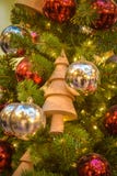 Toy - a wooden Christmas tree on a New Year tree royalty free stock photos Toy - a wooden Christmas tree on a New Year tree royalty free stock photos