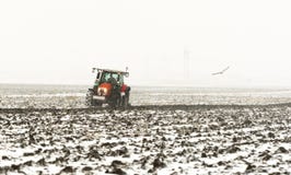 Tractor plowing a field stock image Tractor plowing a field stock image