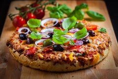 Traditional homemade pizza with tomatoes and olives stock photography Traditional homemade pizza with tomatoes and olives stock photography