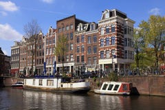 Traditional houses and boats in Jordaan neighborhood and canals stock image Traditional houses and boats in Jordaan neighborhood and canals stock image