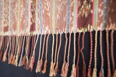 Traditional Indonesian and Asian pattern on fabric with tassels royalty free stock image Traditional Indonesian and Asian pattern on fabric with tassels royalty free stock image