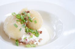 Traditional Lithuanian dish meal cuisine - stuffed meat potato dumpling (Cepelinai,didzkukuliai),Lithuanian national dish, curd royalty free stock images Traditional Lithuanian dish meal cuisine - stuffed meat potato dumpling (Cepelinai,didzkukuliai),Lithuanian national dish, curd royalty free stock images