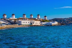 Traditional Mykonos Windmill Against A Blue Sky Above The Sea Royalty Free Stock Photos