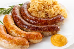 Traditional Oktoberfest menu, plate of sausages and sauerkraut royalty free stock photography Traditional Oktoberfest menu, plate of sausages and sauerkraut royalty free stock photography