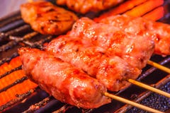 Traditional Thai Isaan Sausage Roasted On The Charcoal Grill Background. Asian, Thai Styled Street Food Appetizer Stock Image