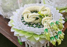 Traditional thai style fresh flower garland on tray