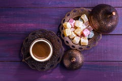 Traditional Turkish Coffee And Turkish Delight On Dark Violet Wooden Background. Flat Lay Stock Images