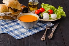 Traditional warming pumpkin soup, homemade with bread and antipasti royalty free stock photos Traditional warming pumpkin soup, homemade with bread and antipasti royalty free stock photos