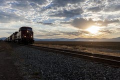 Train On Tracks At Sunrise. Royalty Free Stock Images