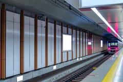 Train running on platform station with billboard on wall royalty free stock images Train running on platform station with billboard on wall royalty free stock images