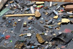 Trash and garbage floating on the surface of the water, causing sewage stock photo Trash and garbage floating on the surface of the water, causing sewage stock photo