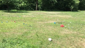 Trash scattered around public park after festival in Berlin stock footage Trash scattered around public park after festival in Berlin stock footage