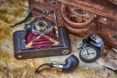 Travel, adventure, exploration with camera folding vintage, old suitcase, compass and map with tobacco pipe royalty free illustration Travel, adventure, exploration with camera folding vintage, old suitcase, compass and map with tobacco pipe royalty free illustration