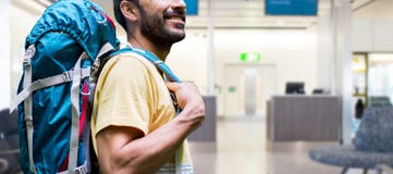 Man with backpack over airport terminal royalty free stock images Man with backpack over airport terminal royalty free stock images