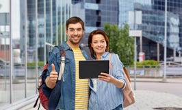 Couple of tourists with tablet computer in city royalty free stock photos Couple of tourists with tablet computer in city royalty free stock photos