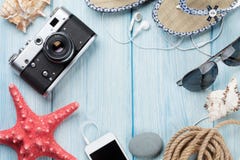 Travel and vacation items on wooden table stock photo Travel and vacation items on wooden table stock photo