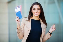 Travel. Woman holding two air ticket in abroad passport near airport royalty free stock images Travel. Woman holding two air ticket in abroad passport near airport royalty free stock images