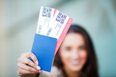 Travel. Woman holding two air ticket in abroad passport near airport stock photography Travel. Woman holding two air ticket in abroad passport near airport stock photography