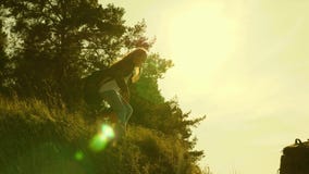 Traveler girls descend from the mountain. Hiker Girl. Family of tourists traveling at sunset. sisters with backpacks stock footage Traveler girls descend from the mountain. Hiker Girl. Family of tourists traveling at sunset. sisters with backpacks stock footage