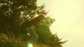 Traveler girls descend from the mountain. Hiker girl. Family of tourists traveling at sunset. Sisters with backpacks stock footage Traveler girls descend from the mountain. Hiker girl. Family of tourists traveling at sunset. Sisters with backpacks stock footage