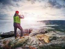 Traveler taking vacation mobile photos of beautiful sunset in autumn nature royalty free stock photography Traveler taking vacation mobile photos of beautiful sunset in autumn nature royalty free stock photography