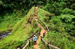 Traveler thai woman walking go to viewpoint of Tad Yeuang waterfall in Bolaven Plateau royalty free stock images Traveler thai woman walking go to viewpoint of Tad Yeuang waterfall in Bolaven Plateau royalty free stock images