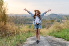 Traveler woman with backpack with arms raised stock images Traveler woman with backpack with arms raised stock images