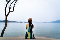 Traveler woman enjoy looking at beautiful lake with mountains on background royalty free stock images Traveler woman enjoy looking at beautiful lake with mountains on background royalty free stock images