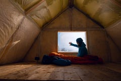 Traveler, Woman Rests In The Old Mountain Hut Stock Image