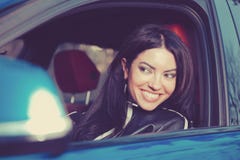 Traveling with fun. Happy woman enjoying road trip in her new car Royalty Free Stock Image Traveling with fun. Happy woman enjoying road trip in her new car Royalty Free Stock Image