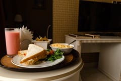 Tray with breakfast on a bed in a hotel room royalty free stock images Tray with breakfast on a bed in a hotel room royalty free stock images