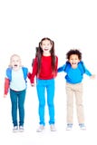 Tre amici felici della scuola immagini stock libere da diritti Tre amici felici della scuola immagini stock libere da diritti
