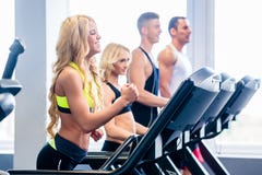 Treadmill group exercising in fitness gym stock photo Treadmill group exercising in fitness gym stock photo