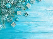 Tree branch, season ball, card snow on a blue wooden background, frame royalty free stock photos Tree branch, season ball, card snow on a blue wooden background, frame royalty free stock photos