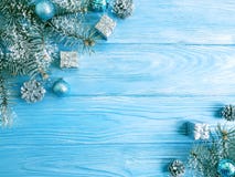 Tree branch, season ball, snow on a blue wooden background, frame royalty free stock images Tree branch, season ball, snow on a blue wooden background, frame royalty free stock images