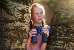 Tree, girl and binoculars for safari, search and looking for animals on travel holiday. Curious, explore and seek for