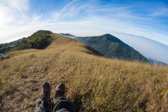 trekker at mountain landscape trekking route walking trail to the peak Royalty Free Stock Images trekker at mountain landscape trekking route walking trail to the peak Royalty Free Stock Images