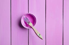 Trendy Pastel Colors. A Paintbrush And A Paint Jar On A Purple Wooden Background. Top View. Flat Lay. Copy Space Stock Photos