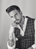 Trendy young man in studio shot wearing elegant vest Stock Photos Trendy young man in studio shot wearing elegant vest Stock Photos