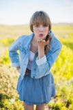 Trendy young woman sending kiss to camera Stock Photography Trendy young woman sending kiss to camera Stock Photography
