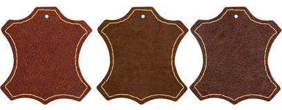 Tres muestras de cuero marrones en el fondo blanco imagenes de archivo Tres muestras de cuero marrones en el fondo blanco imagenes de archivo