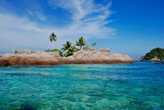 Tropical Blue Sea With Small Island With Palm Tree Stock Photos