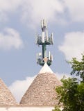 Trulli and antenna: technology and tradition in ugly contrast stock image Trulli and antenna: technology and tradition in ugly contrast stock image