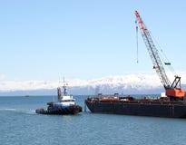 Tug Boat And Crane Stock Photo
